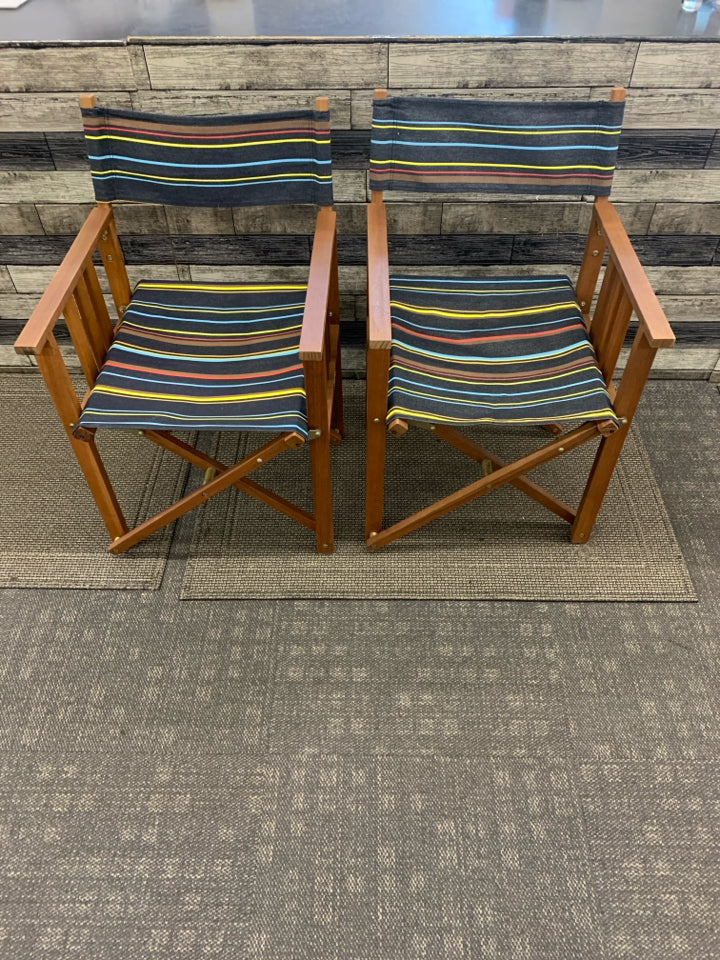 2 FOLD UP DIRECTOR CHAIRS DARK BROWN W/ COLORFUL STRIPE PATTERN.