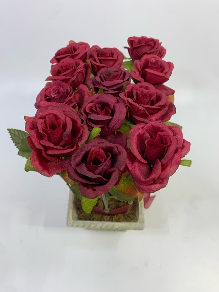 RED ROSE FAUX FLOWERS IN WHITE DECORATED RECTANGULAR POT W/RED RIBBON.
