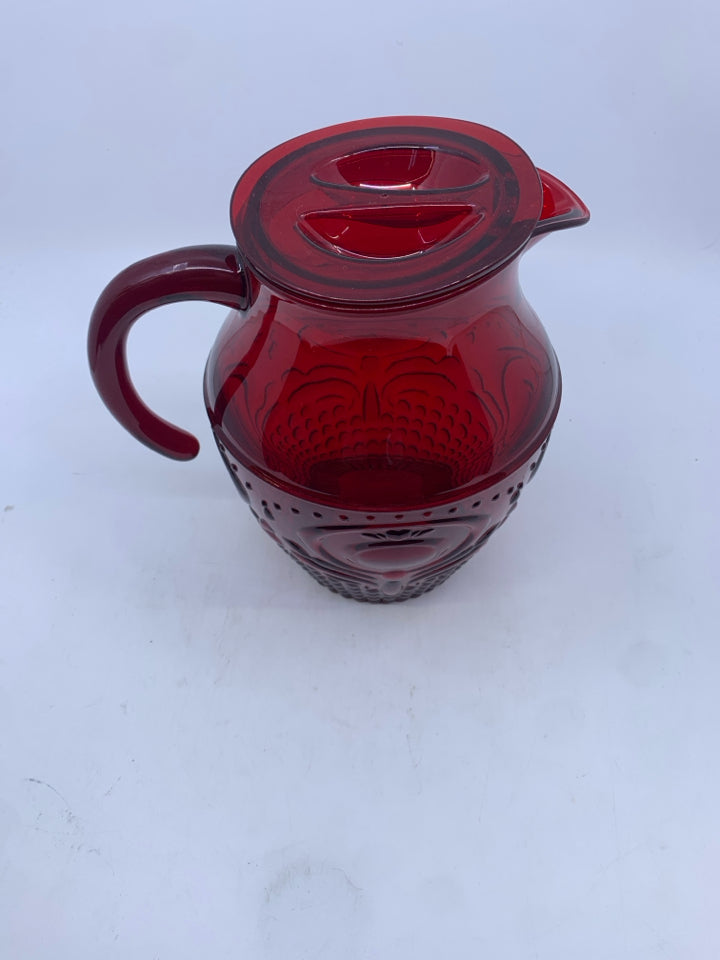 RED EMBOSSED PLASTIC PITCHER.