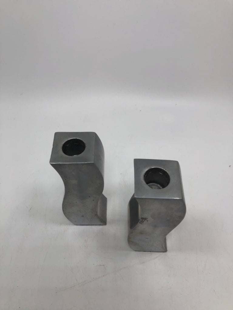 2 CURVY METAL CANDLE STICK HOLDERS.