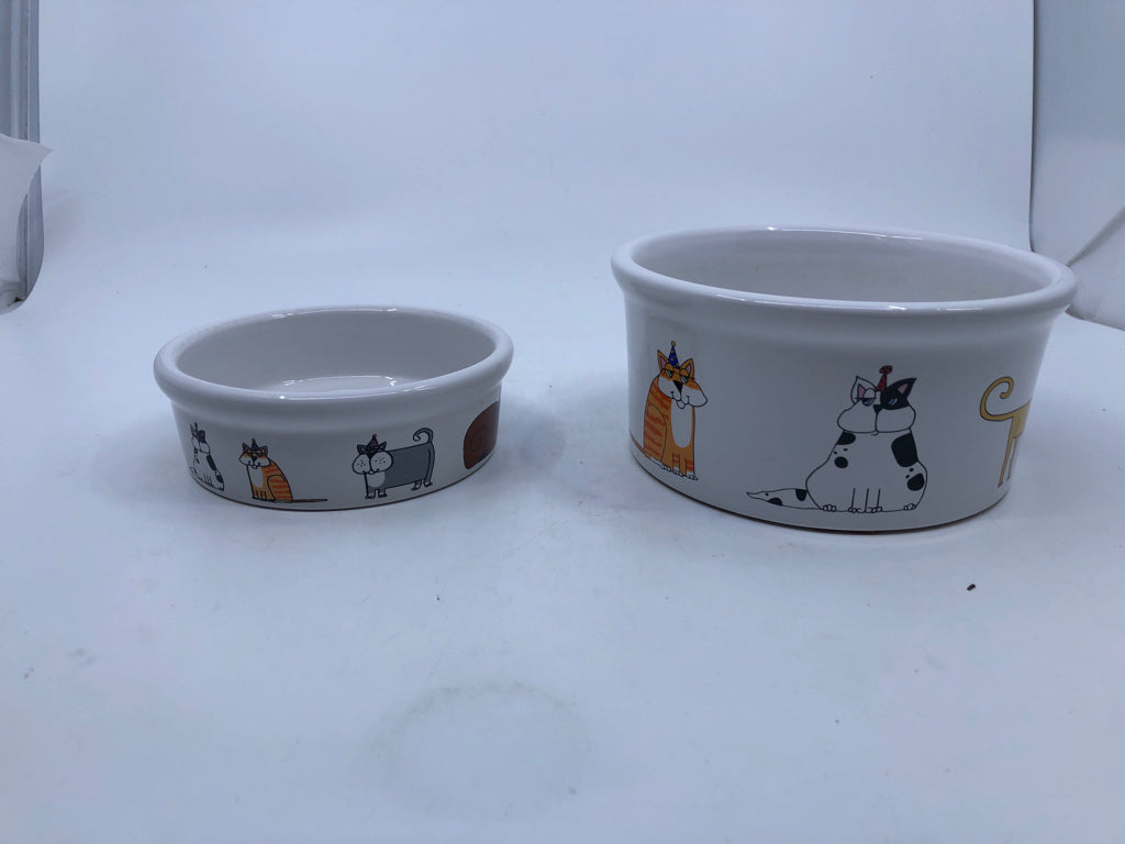 2 NESTING CAT DISHES W DIFFERENT TYPES OF CATS.