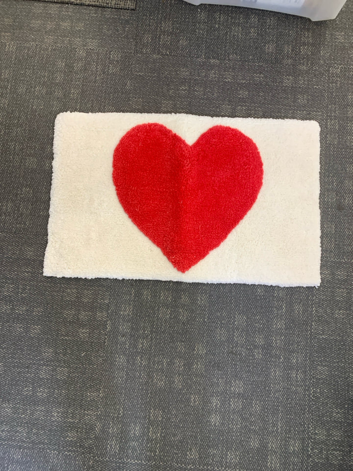 WHITE W RED HEART BATH MAT.