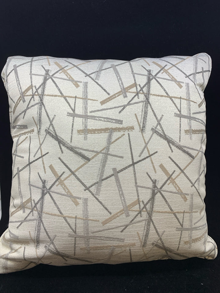 CREAM PILLOW W/GOLD, SILVER LINES.