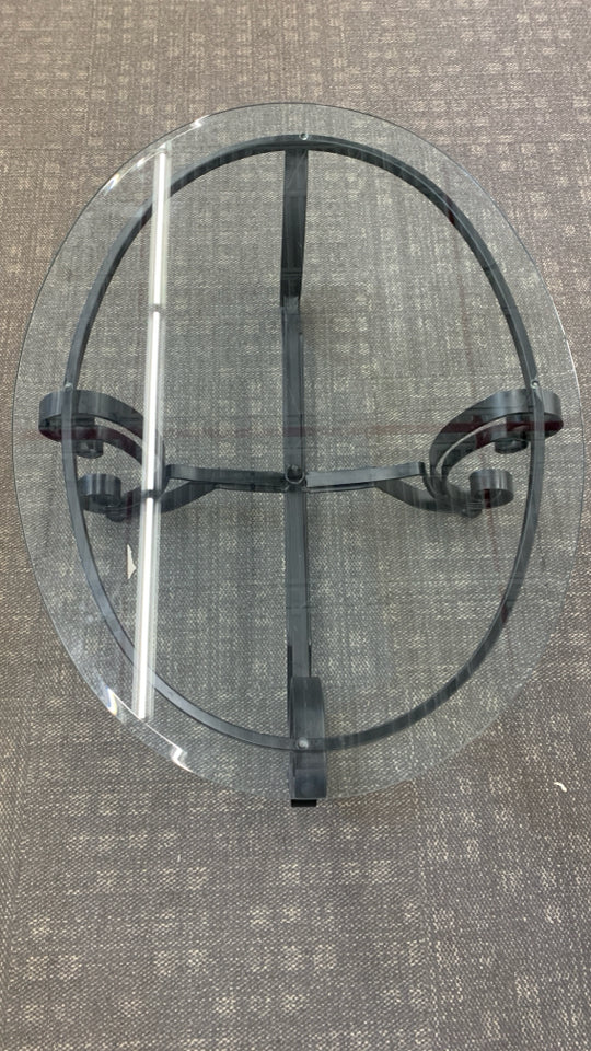 GLASS TOP METAL SCROLL COFFEE TABLE.