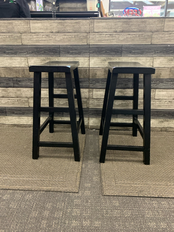 2 BLACK SADDLE SEAT STOOLS.