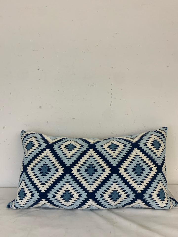 LONG DARK BLUE PILLOW W/ LIGHT BLUE/WHITE WOVEN DIAMOND PATTERN.