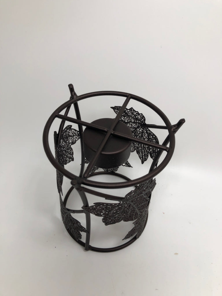 METAL LEAF CANDLE HOLDER.