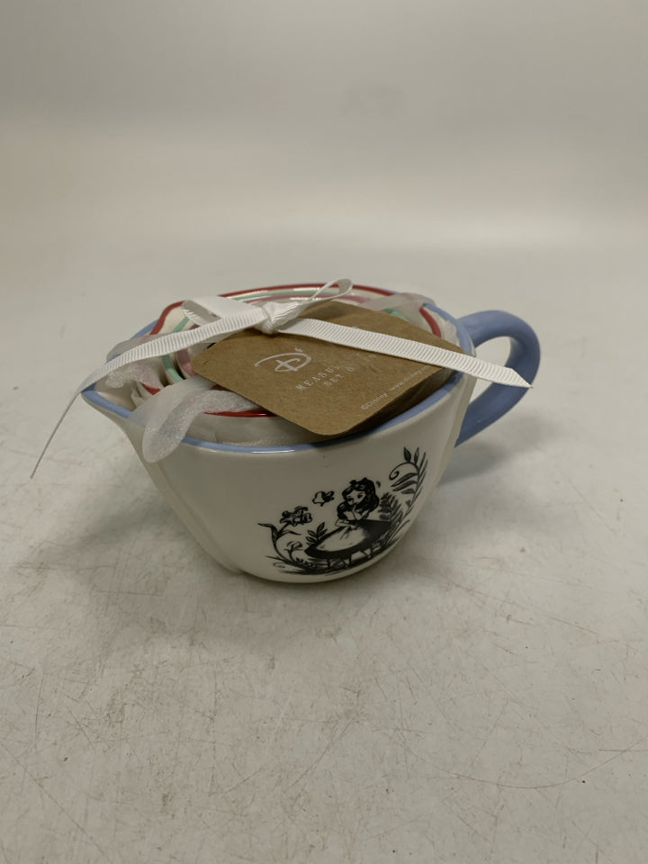 NIP 4 ALICE IN WONDERLAND MEASURING CUPS NESTING.