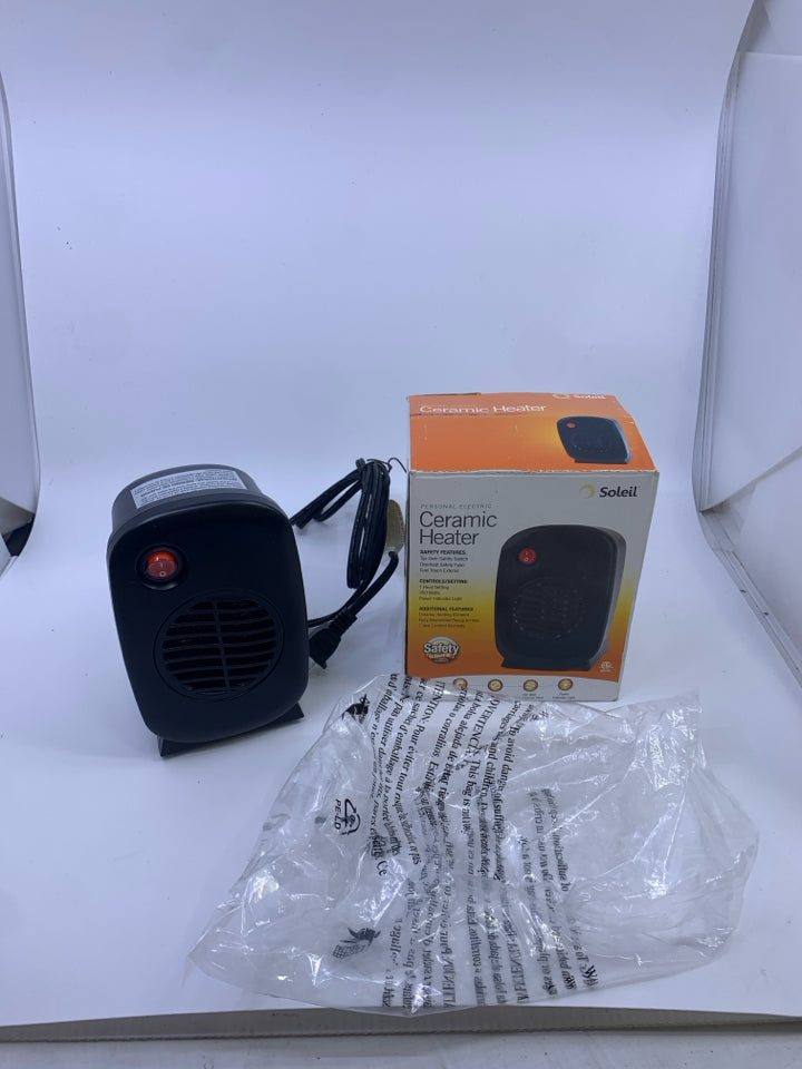 NIB SMALL CERAMIC HEATER.