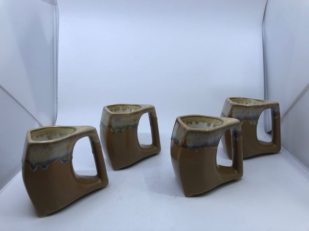4 LARGE TAN DRIP POTTERY MUGS.