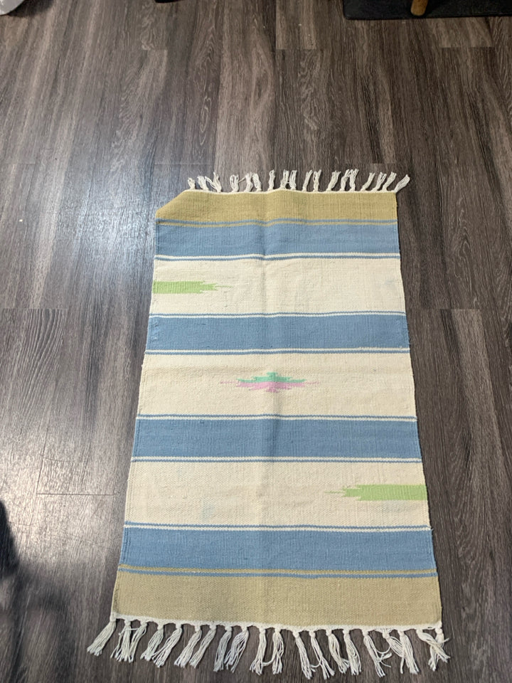 ASSORTED COLORS WOVEN AZTEC PATTERN RUG W/ TASSELS.
