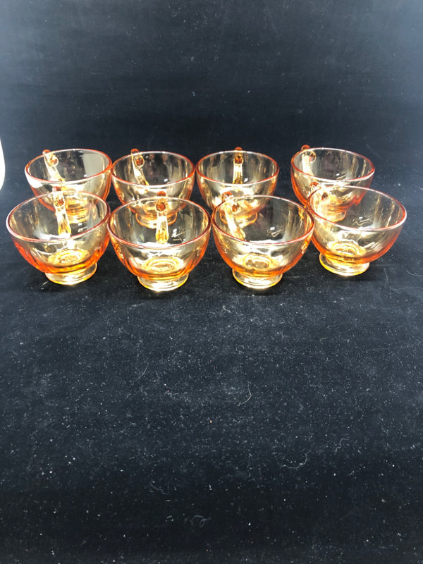 8 AMBER GLASS TEA CUPS AND SAUCERS.