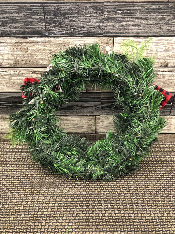 WREATH W FROSTED PINE CONES.