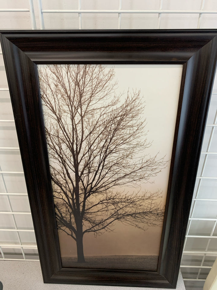 BARE TREE SILHOUETTE IN BROWN WOOD FRAME.