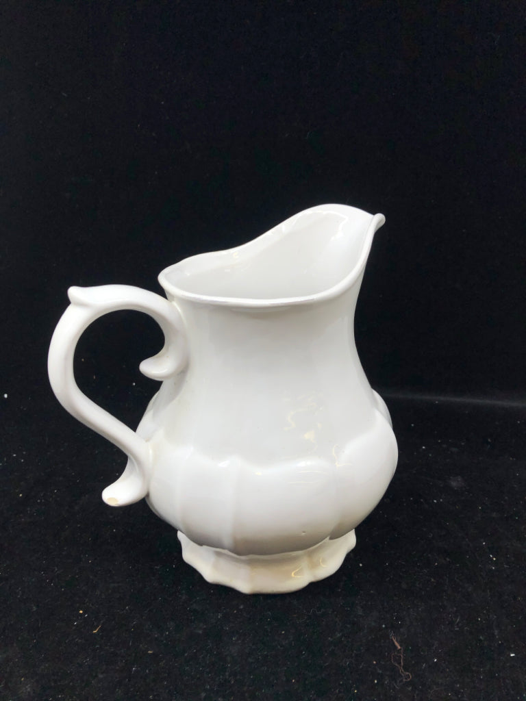 WHITE CERAMIC PITCHER VASE.