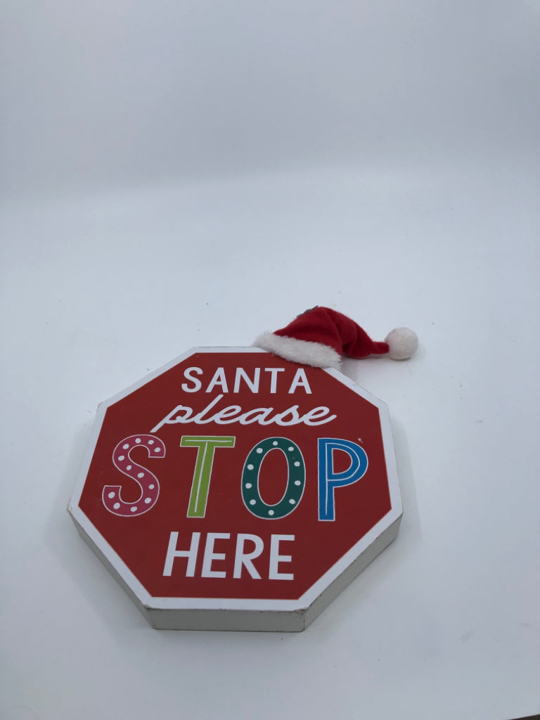 SANTA PLEASE STOP STANDING SIGN.