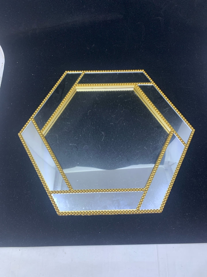MIRRORED W GOLD ACCENTS ON HEXAGON TRAY.