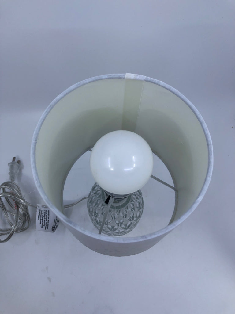 CLEAR GLASS LAMP W WHITE SHADE.