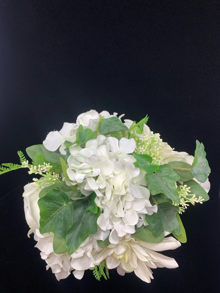 WHITE FLOWERS IN SQUARE GLASS VASE.