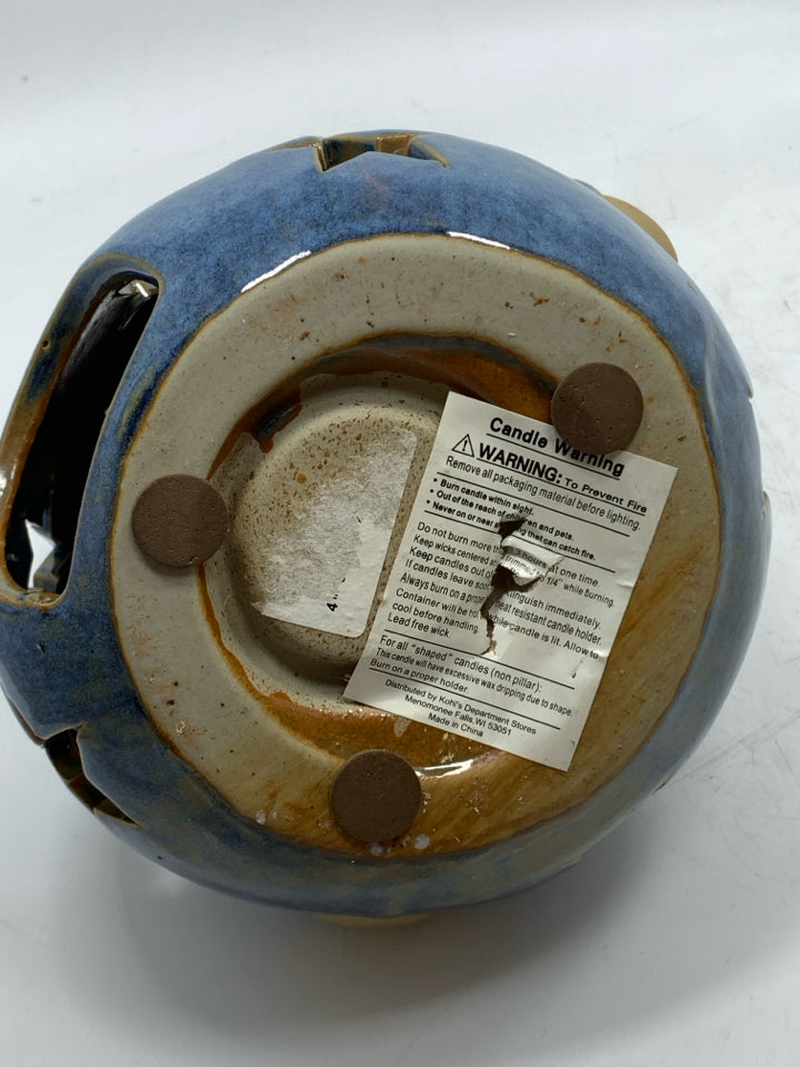 BLUE STAR PIERCED FAT SNOWMAN TEALIGHT HOLDER.