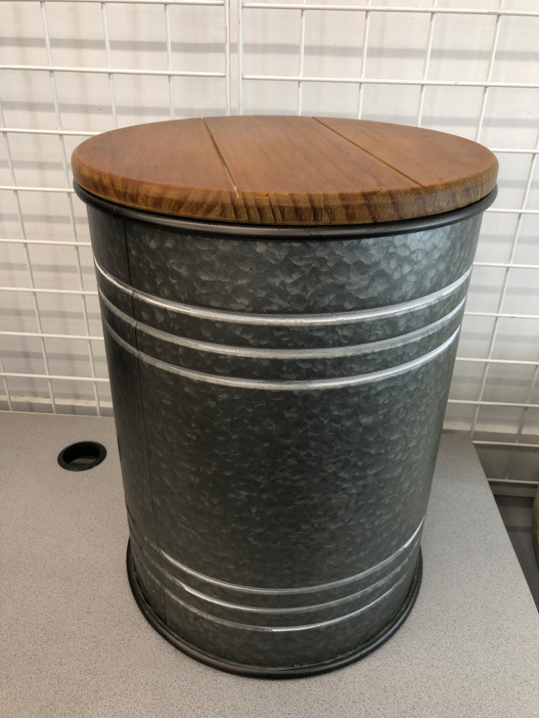 LARGE METAL BARREL HALLOW TABLE W/ WOOD TOP.