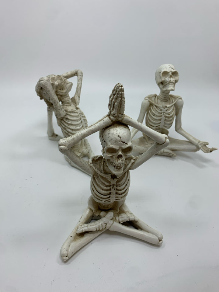 3 YOGA RESIN SKELETONS.
