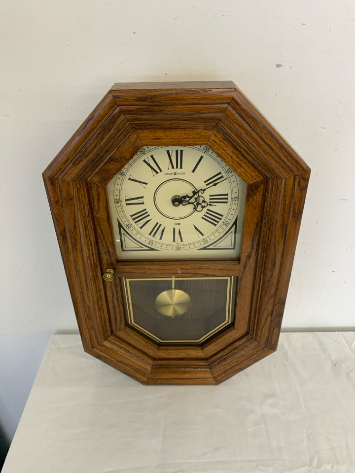 HOWARD MILLER WOOD HANGING CLOCK.