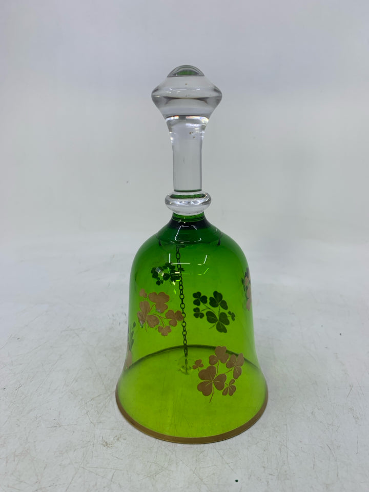 GREEN GLASS BELL W/ GOLD PAINTED SHAM ROCKS.