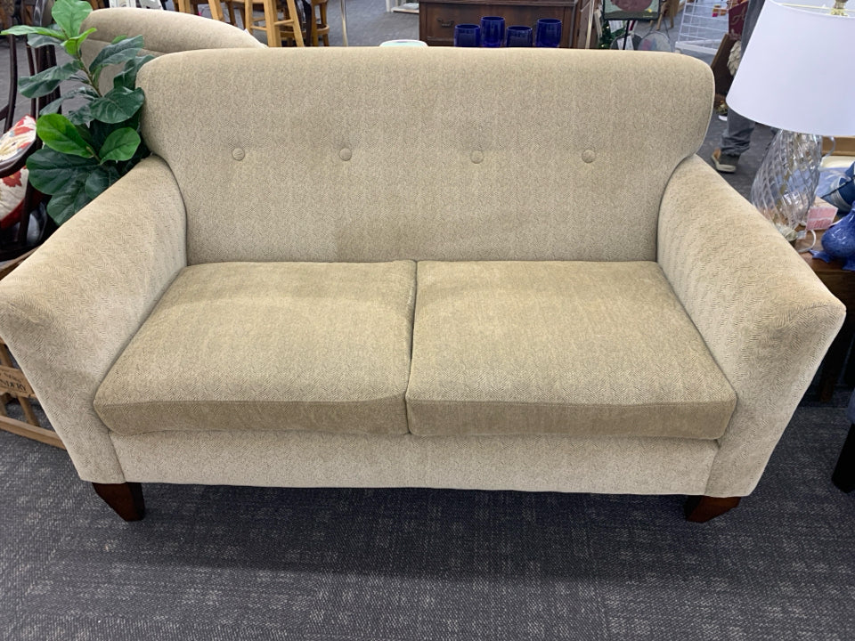 CREAM AND GREY ACCENT WOOD FOOTED LOVE SEAT.