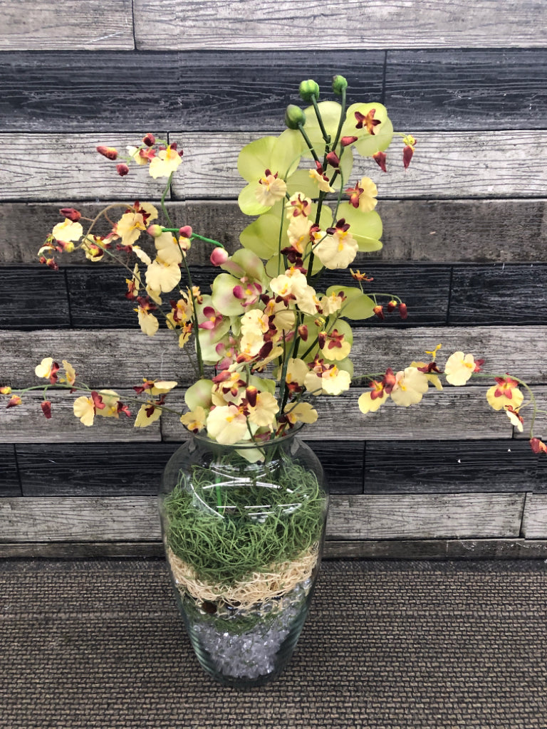 FAUX YELLOW ORCHIDS IN MARBLE FILLED VASE.