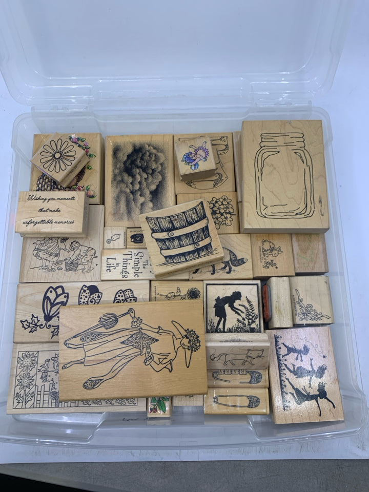35 ASSORTED STAMPS IN CLEAR PLASTIC CASE.