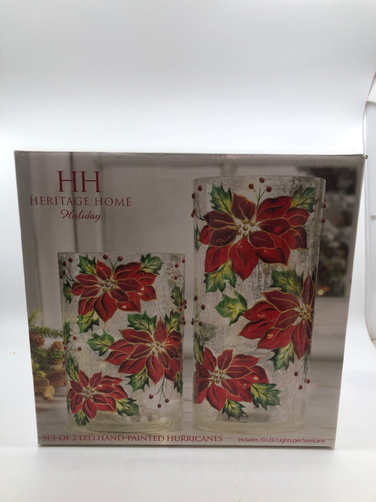 2 LED POINSETTIA HURRICANE LIGHTS IN BOX.