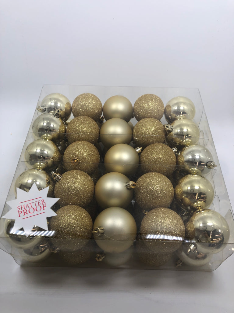 NIP 50PC GOLD ORNAMENTS.