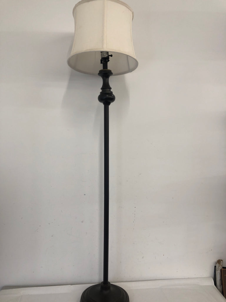 BLACK BASE FLOOR LAMP W CREAM SHADE.