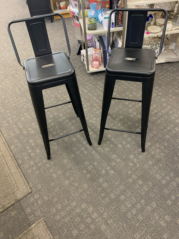 2 BLACK METAL LOW BACK STOOLS.