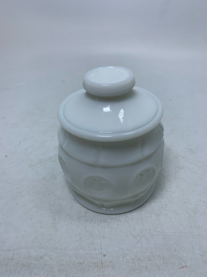 VTG SMALL MILK GLASS CANISTER W/ EAGLE COIN DETAILS.