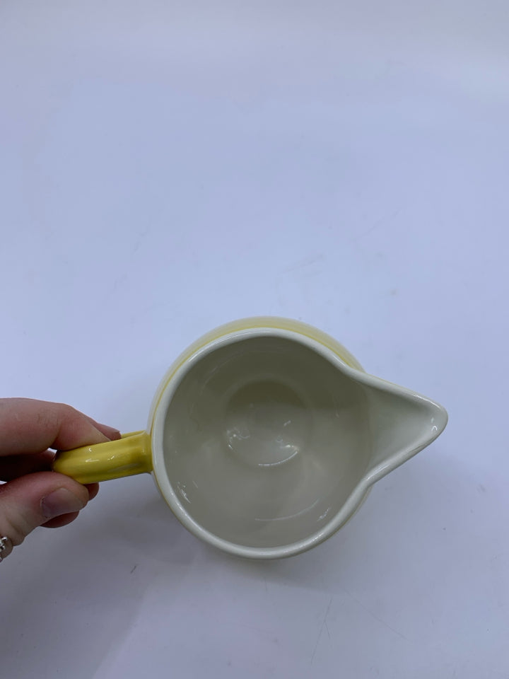 SMALL YELLOW RIBBED PITCHER.