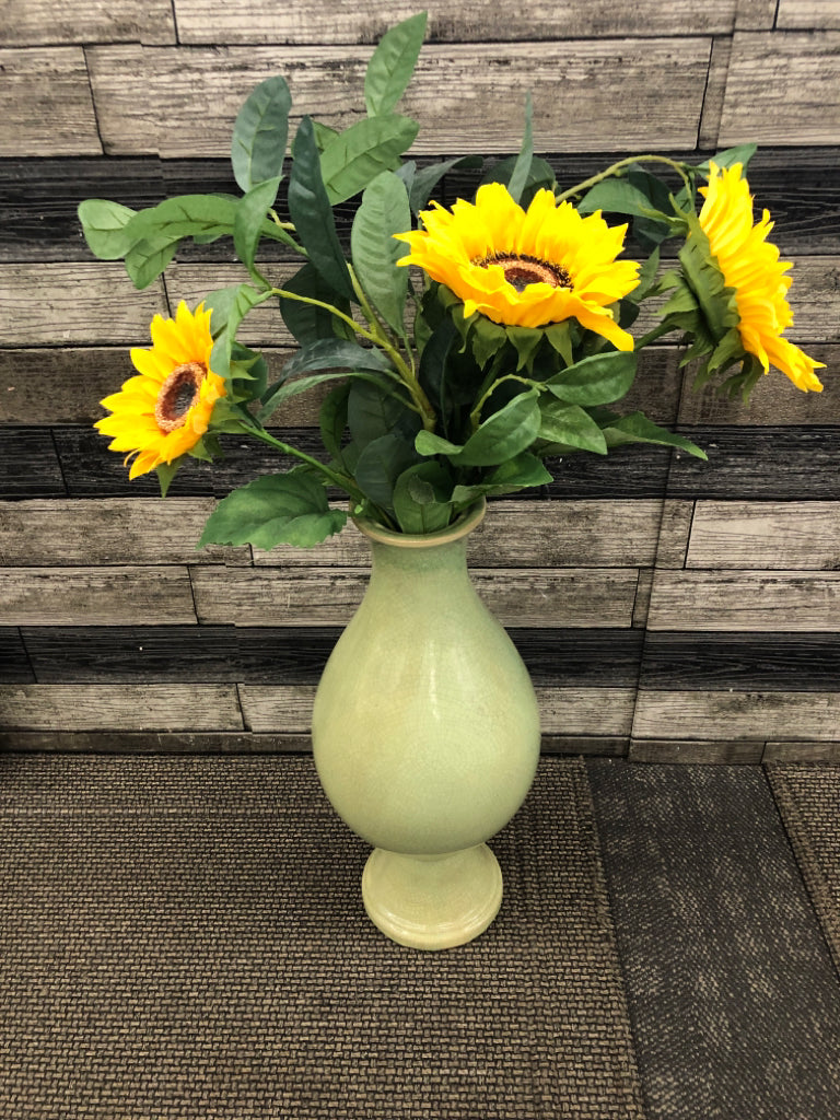 FAUX FLOWERS IN LARGE GREEN VASE.
