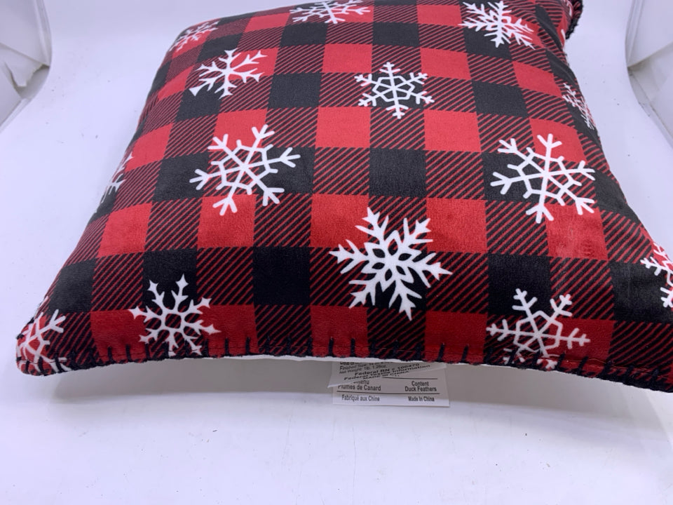 RED BUFFALO PLAID ACCENT PILLOW WITH SNOWFLAKES.