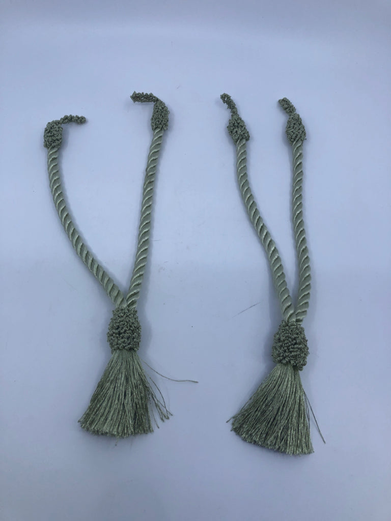 2 GREEN CURTAIN TIE BACKS.