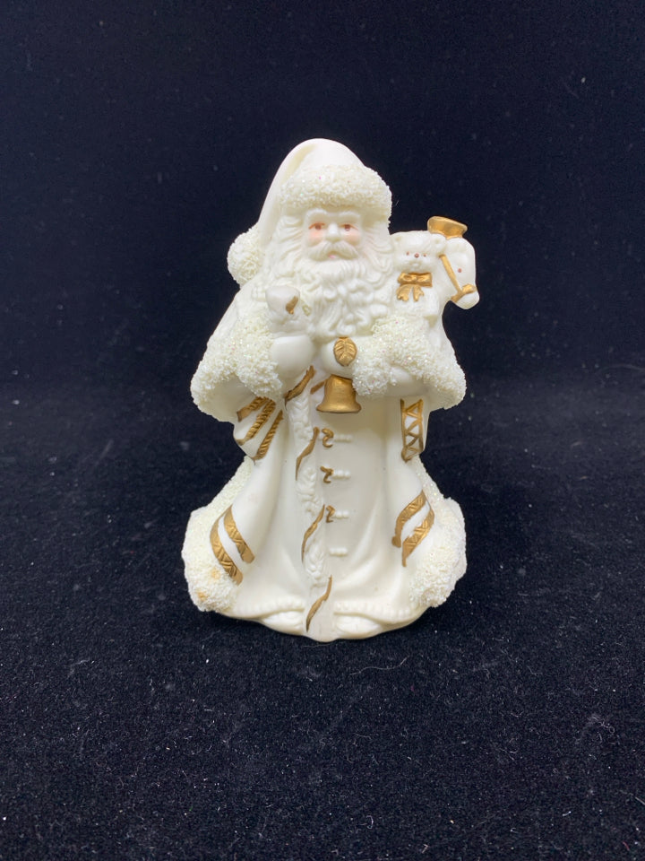 GOLD AND CREAM SANTA FIGURE.