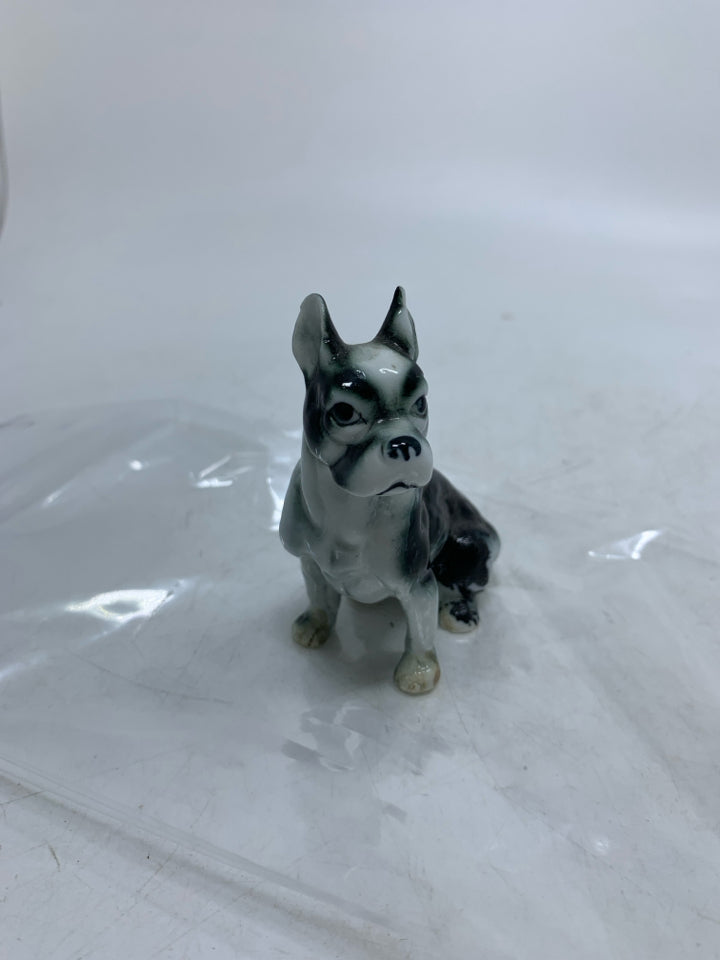 BLACK/WHITE DOG W/ POINTED EARS IN BAG.