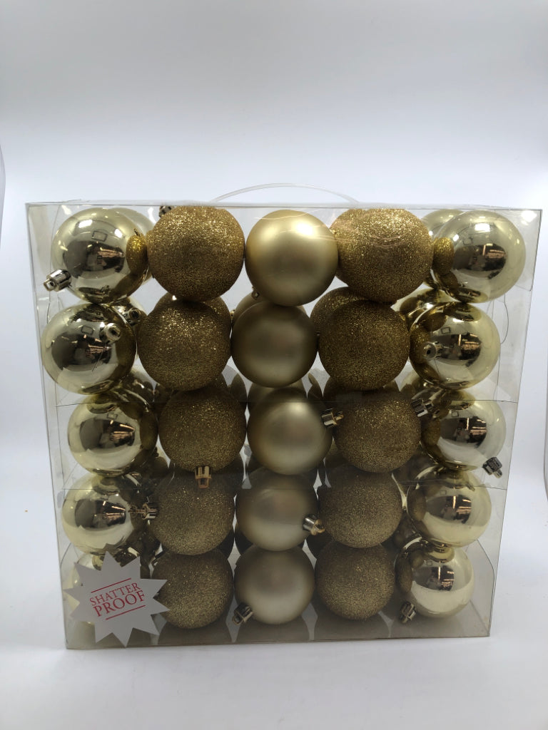 NIP 50PC GOLD ORNAMENTS.