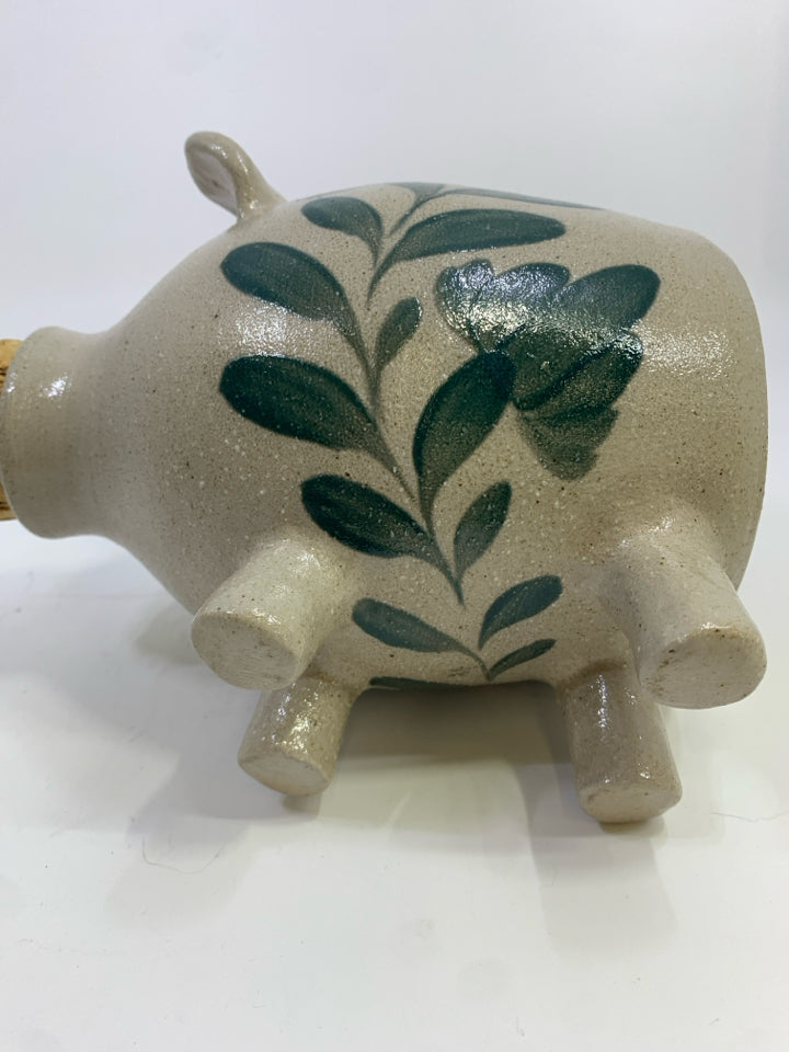 STONEWARE PIGGY BANK W/CORK SNOUT & PAINTED LEAVES.