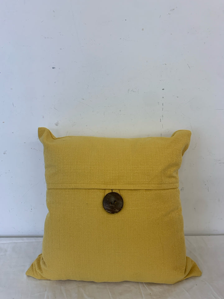 MUSTARD YELLOW PILLOW W/ BUTTON.