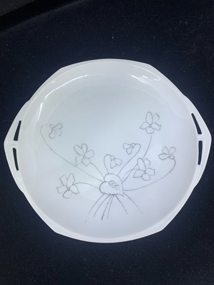 WHITE OVAL SERVING DISH WITH HAND DRAWN FLORAL DESIGN.