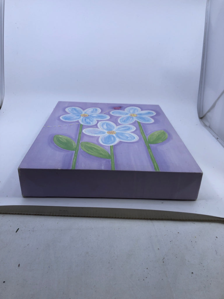 PURPLE CANVAS W/ BLUE FLOWERS.