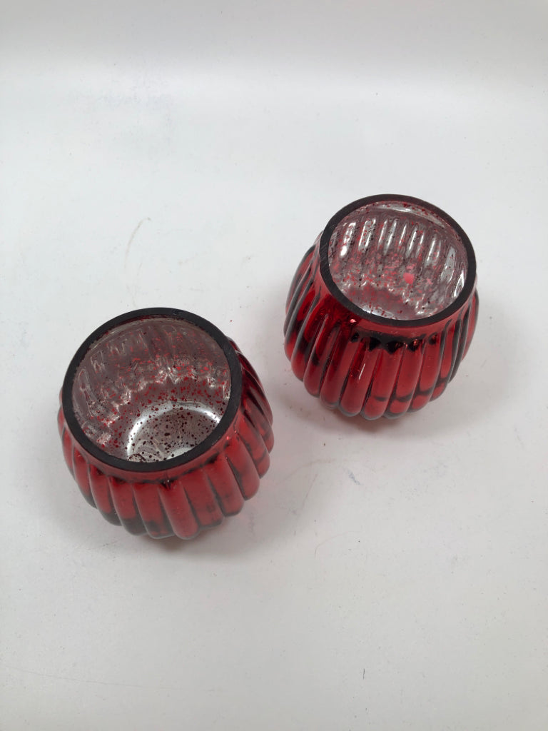 2 RED RIBBED GLASS TEALIGHT HOLDERS.