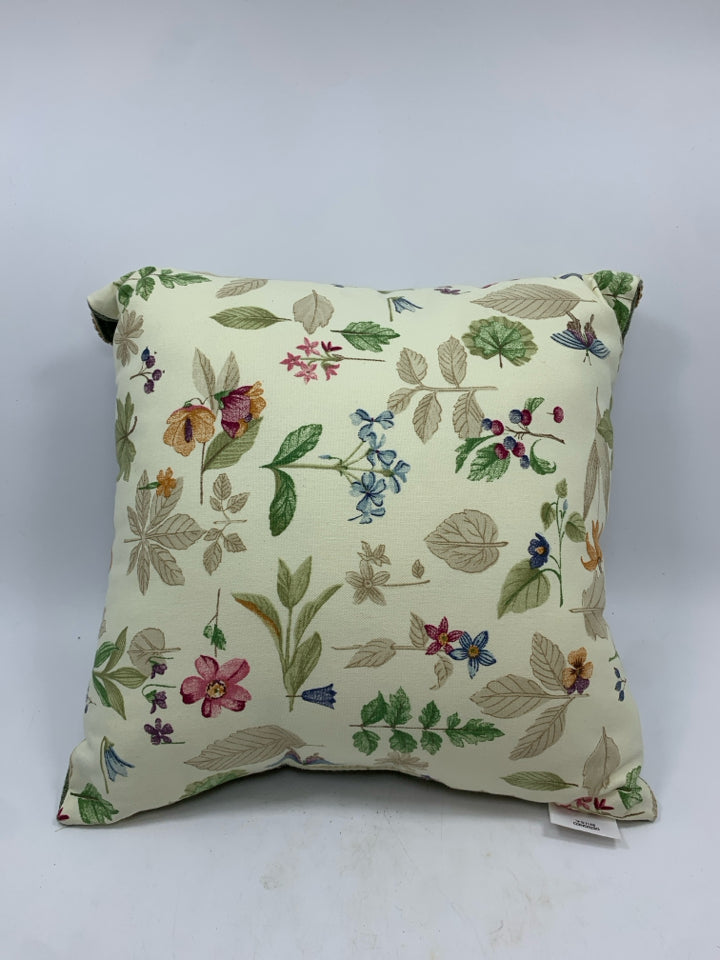 FLORAL THROW PILLOW WITH ENVELOPE DESIGN.