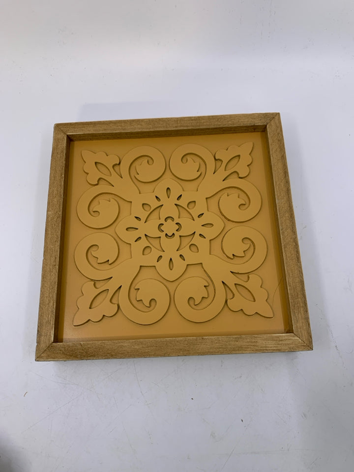 WOOD FRAME W/ ORANGE MEDALLION.